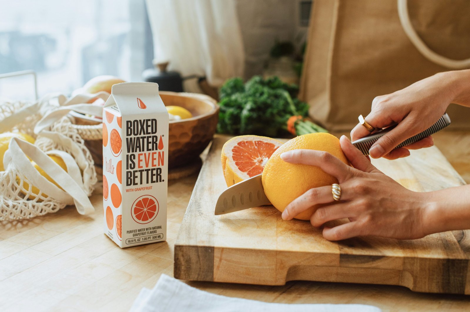 5 Things You Can Do to Improve Your Health 1 a person cutting an orange on a cutting board