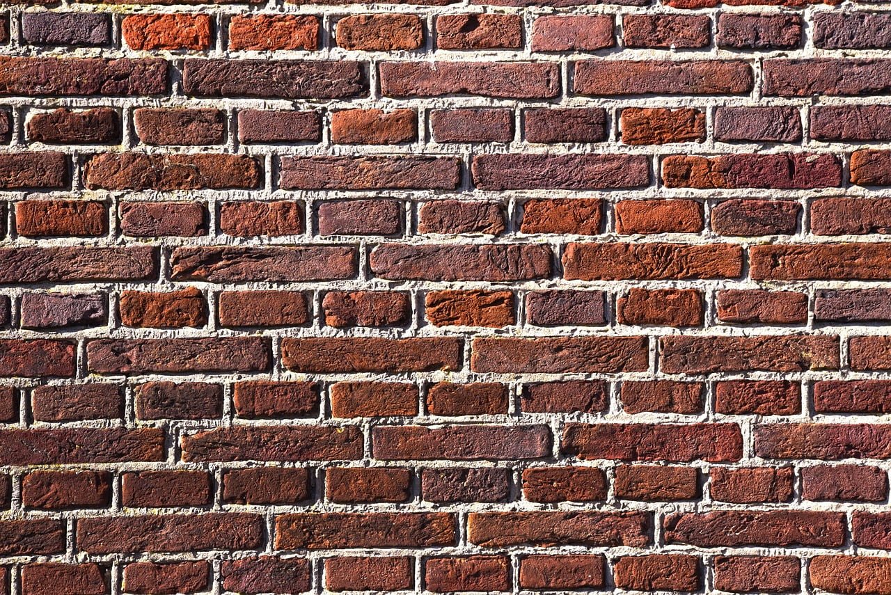 red-brick-wall-stone-bricks-3541092 masonry peoria il